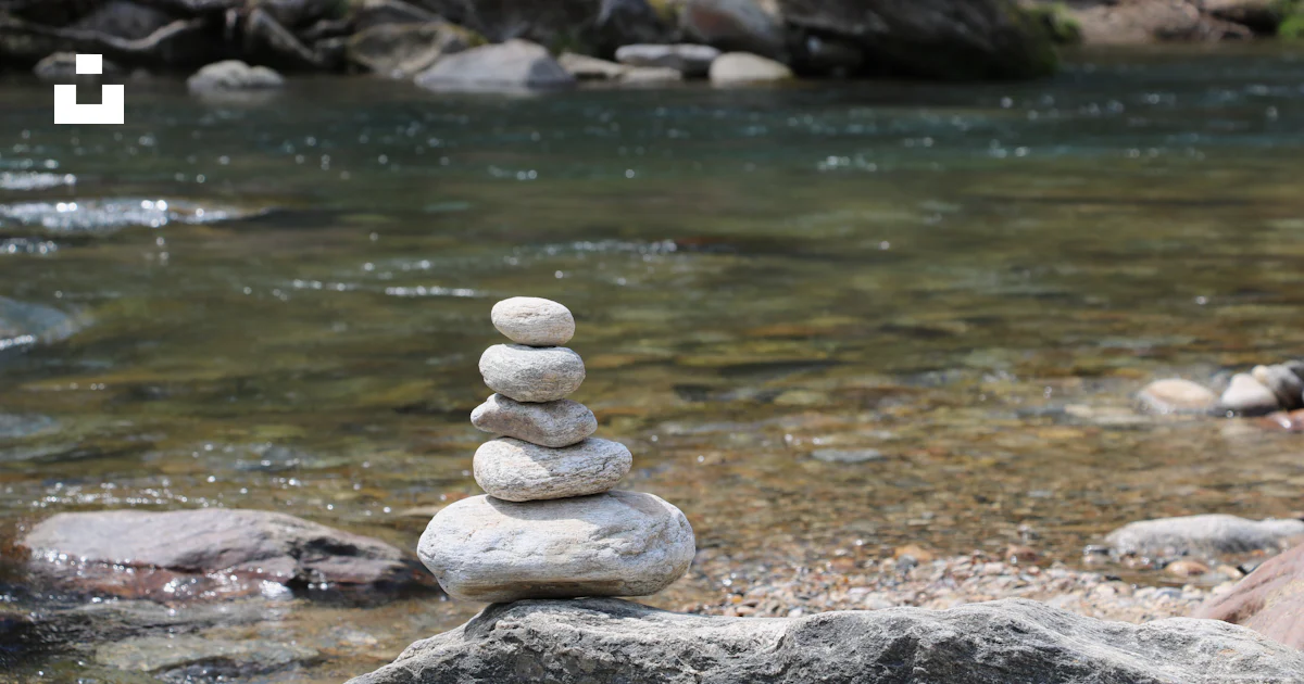 Stacking Riverbed Rocks A stack of rocks sitting on top of a river photo – Free Chimney rock ...