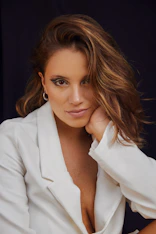 a woman in a white shirt posing for a picture