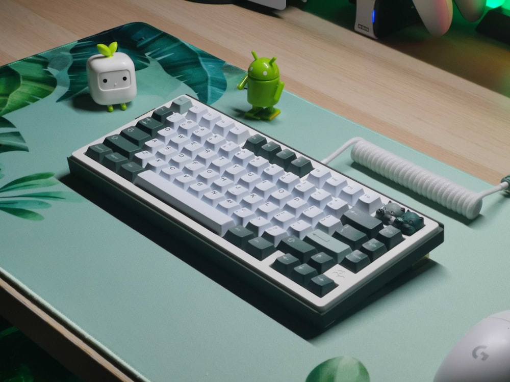 a computer keyboard sitting on top of a desk