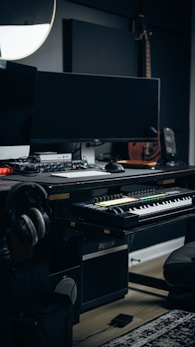 a keyboard and a monitor in a room