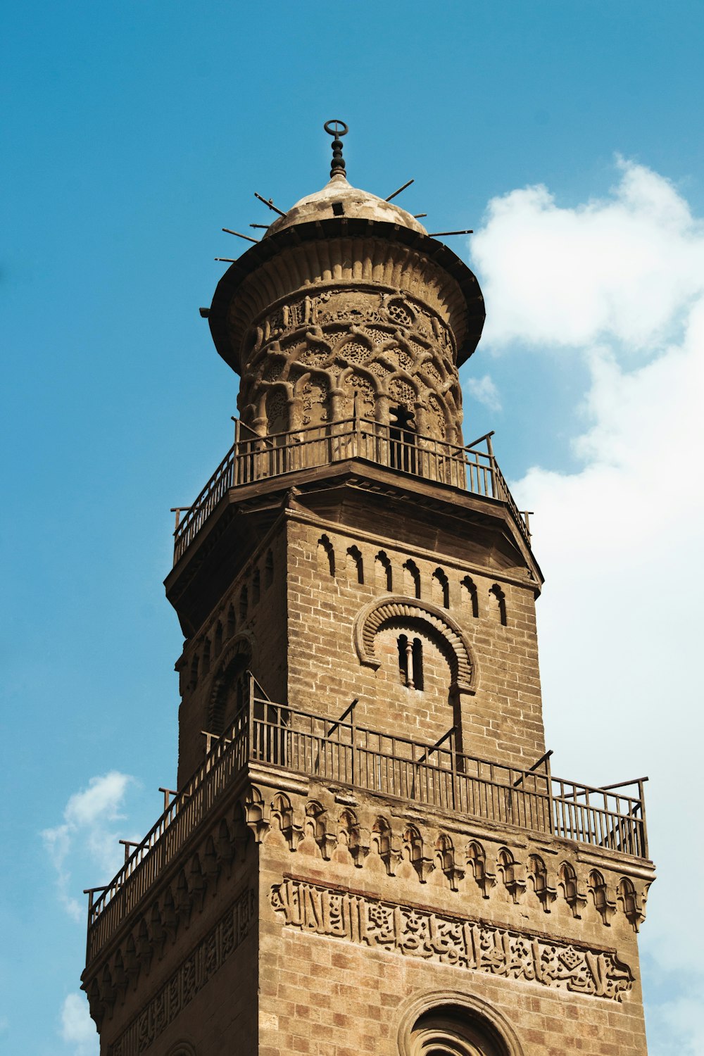 a tall tower with a clock on the top of it