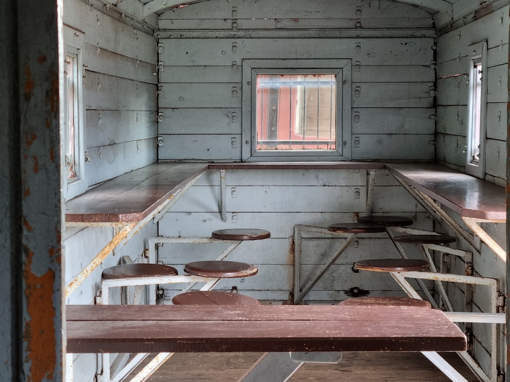 a room that has some tables and benches in it