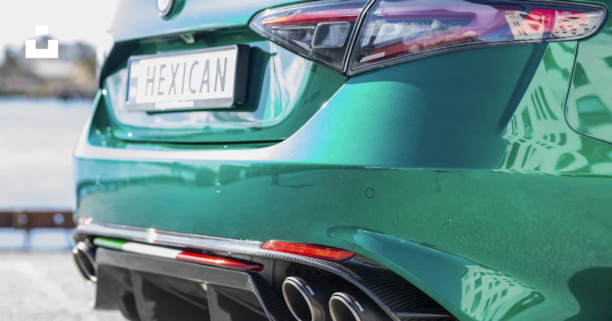 The rear end of a green sports car photo – Free Blue Image on Unsplash