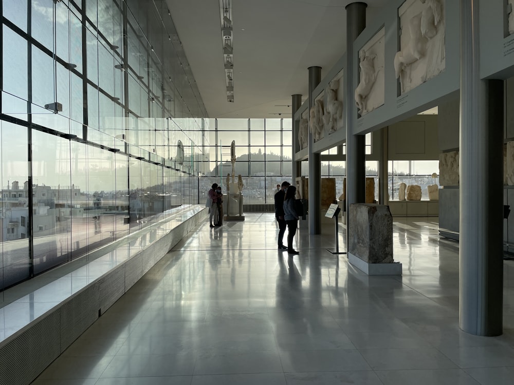 a couple of people that are standing in a building