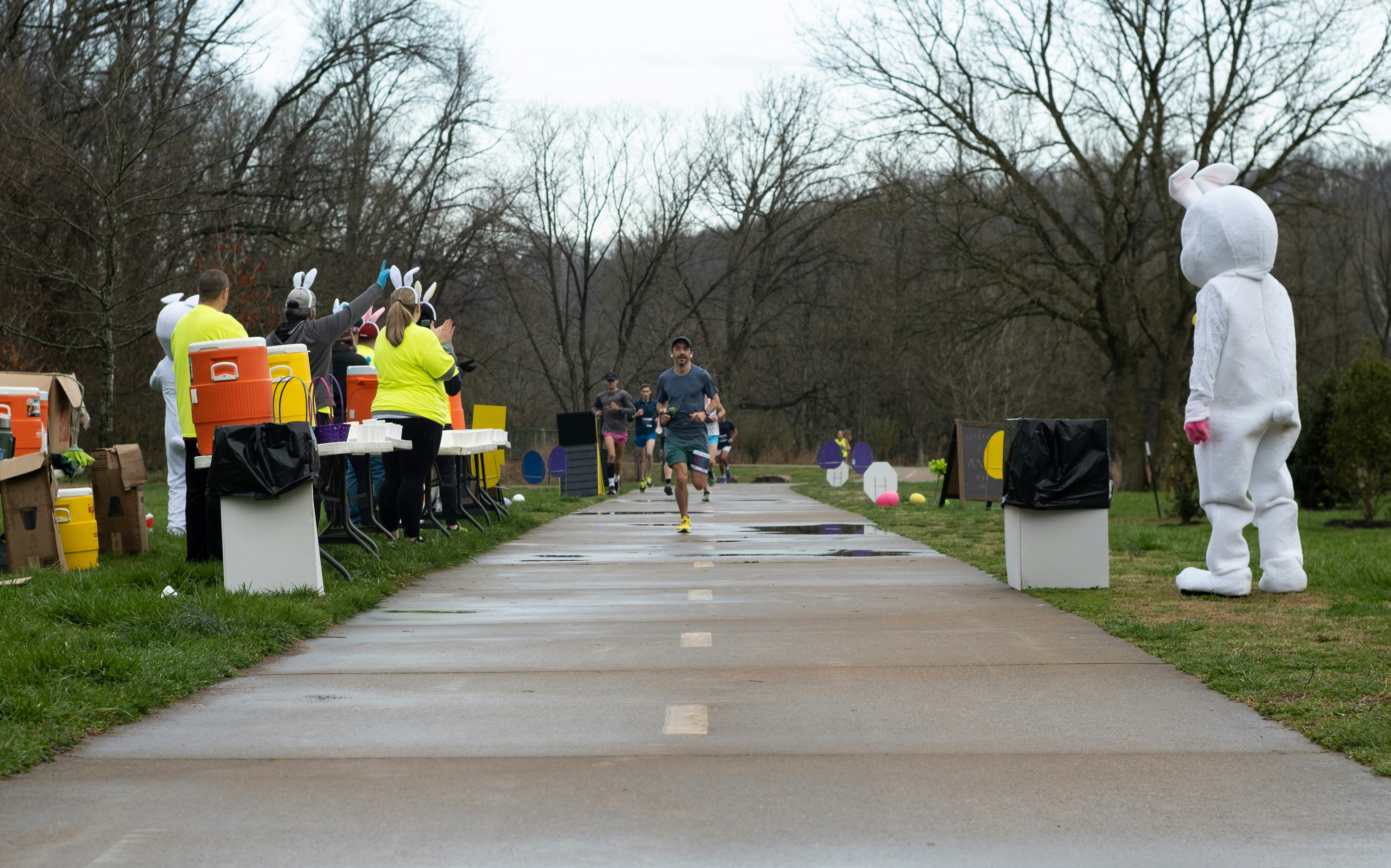 a group of people riding bikes down a sidewalk