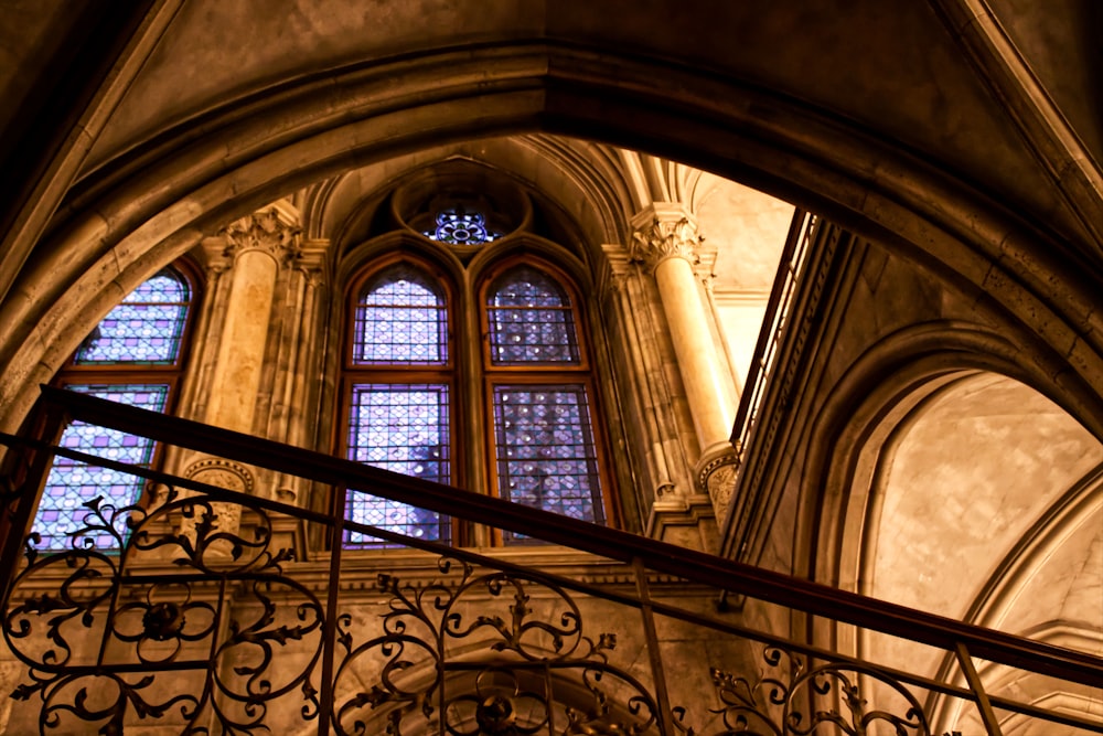 a staircase leading to a large window in a building