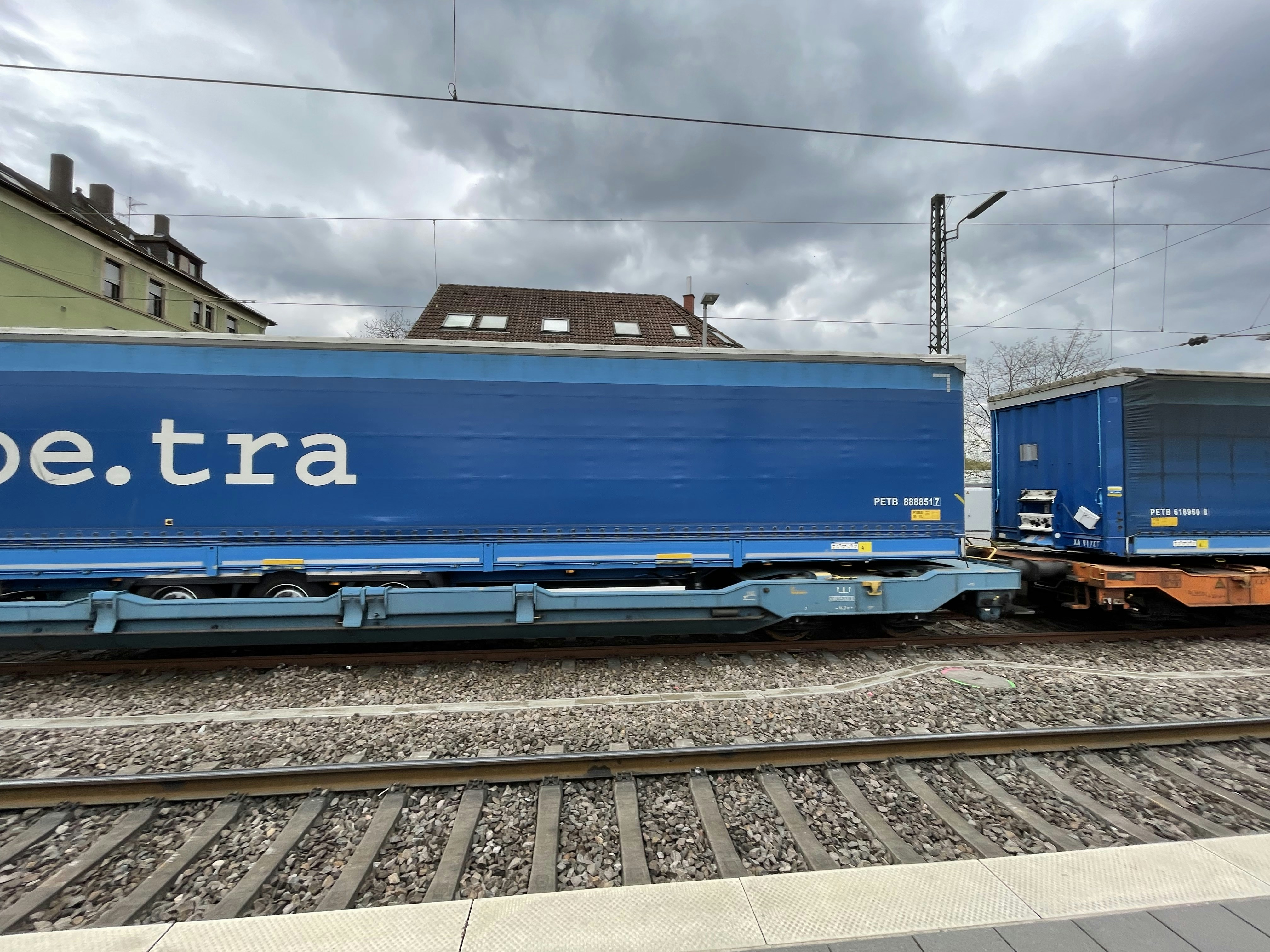 Blue train car on tracks
