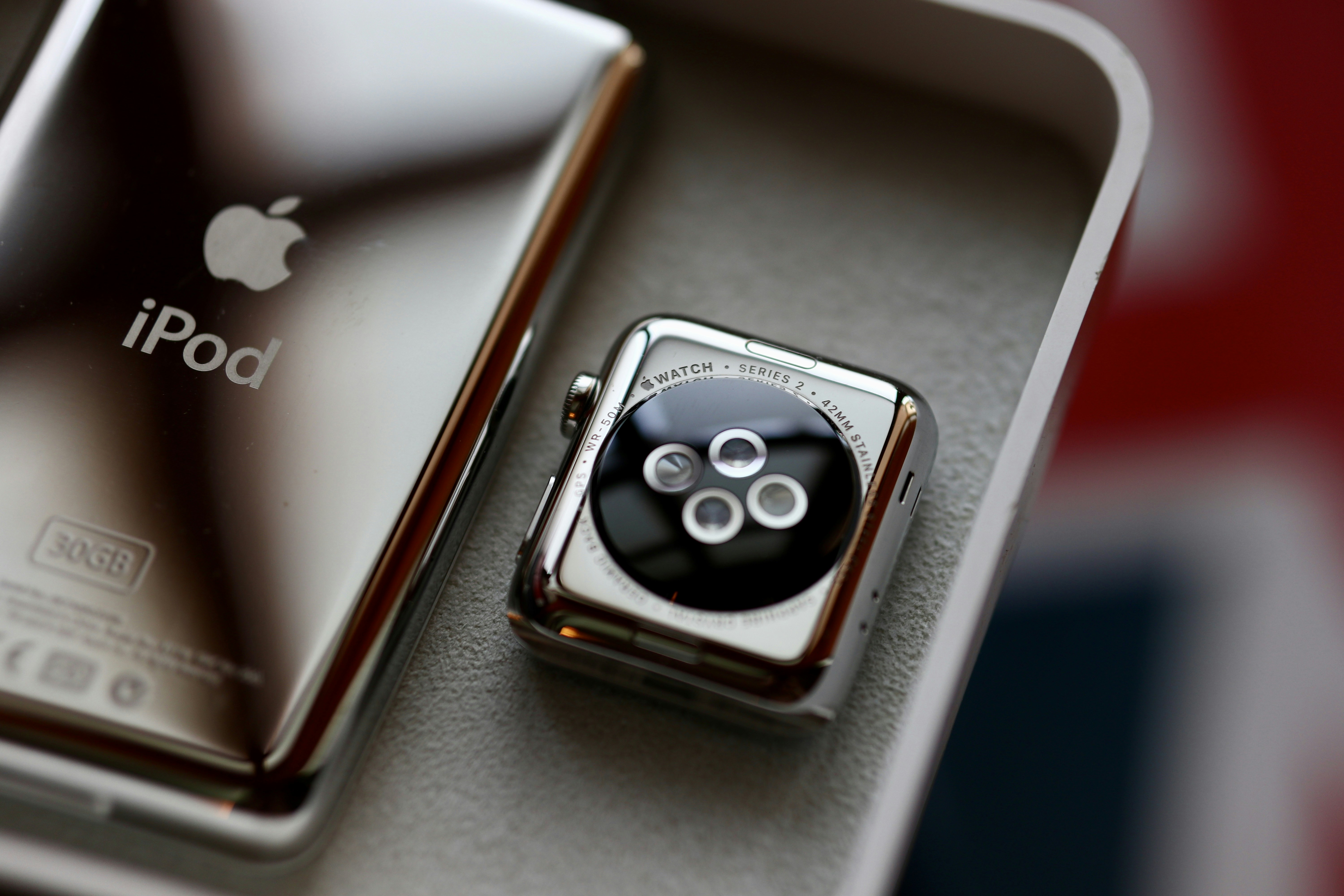a couple of cell phones sitting on top of a table