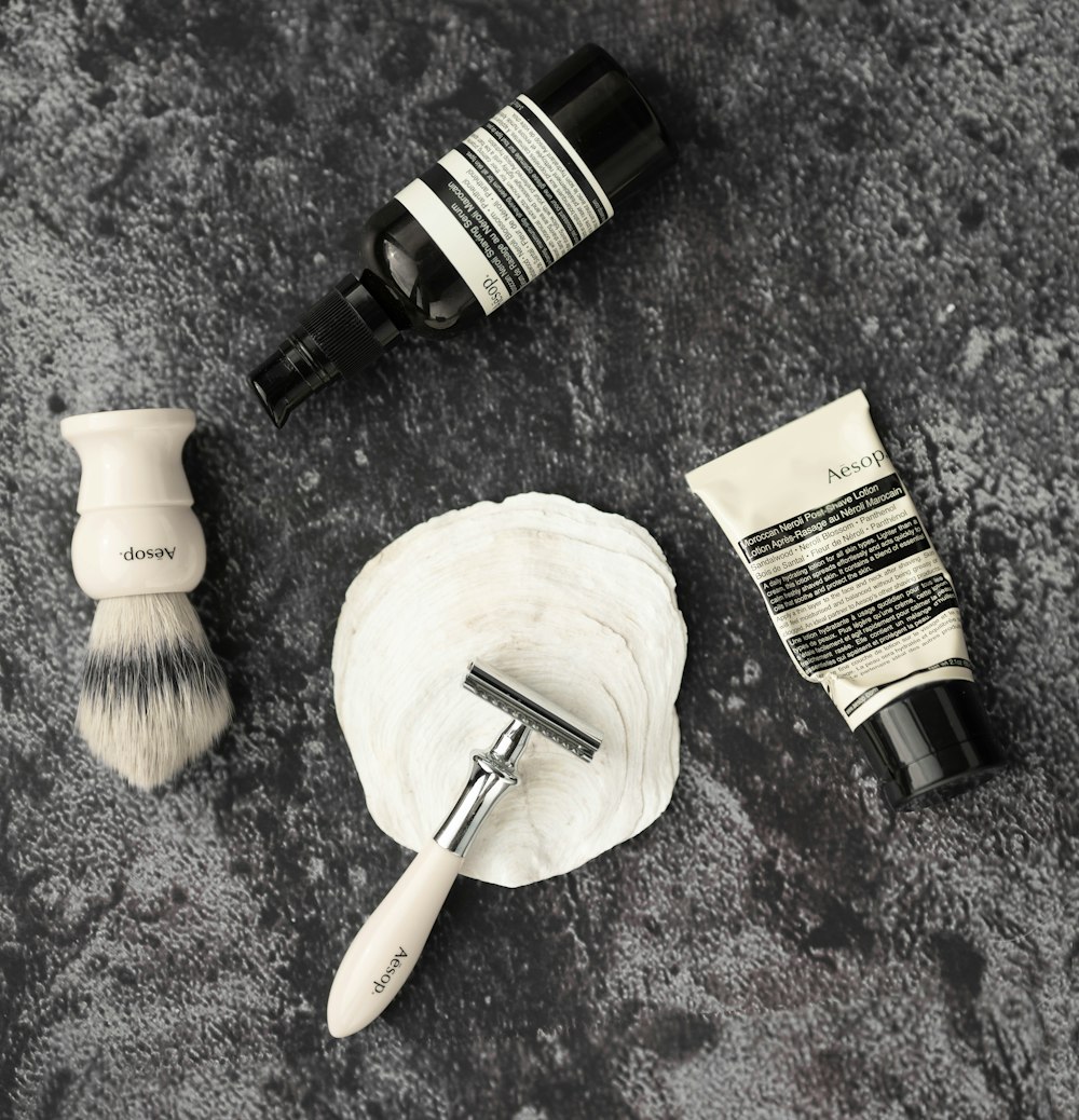 a shaving brush, shaving bowl, shaving razor, and shaving