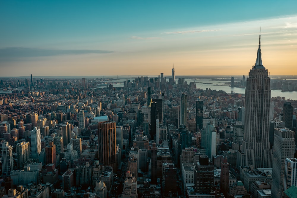 an aerial view of a city at sunset