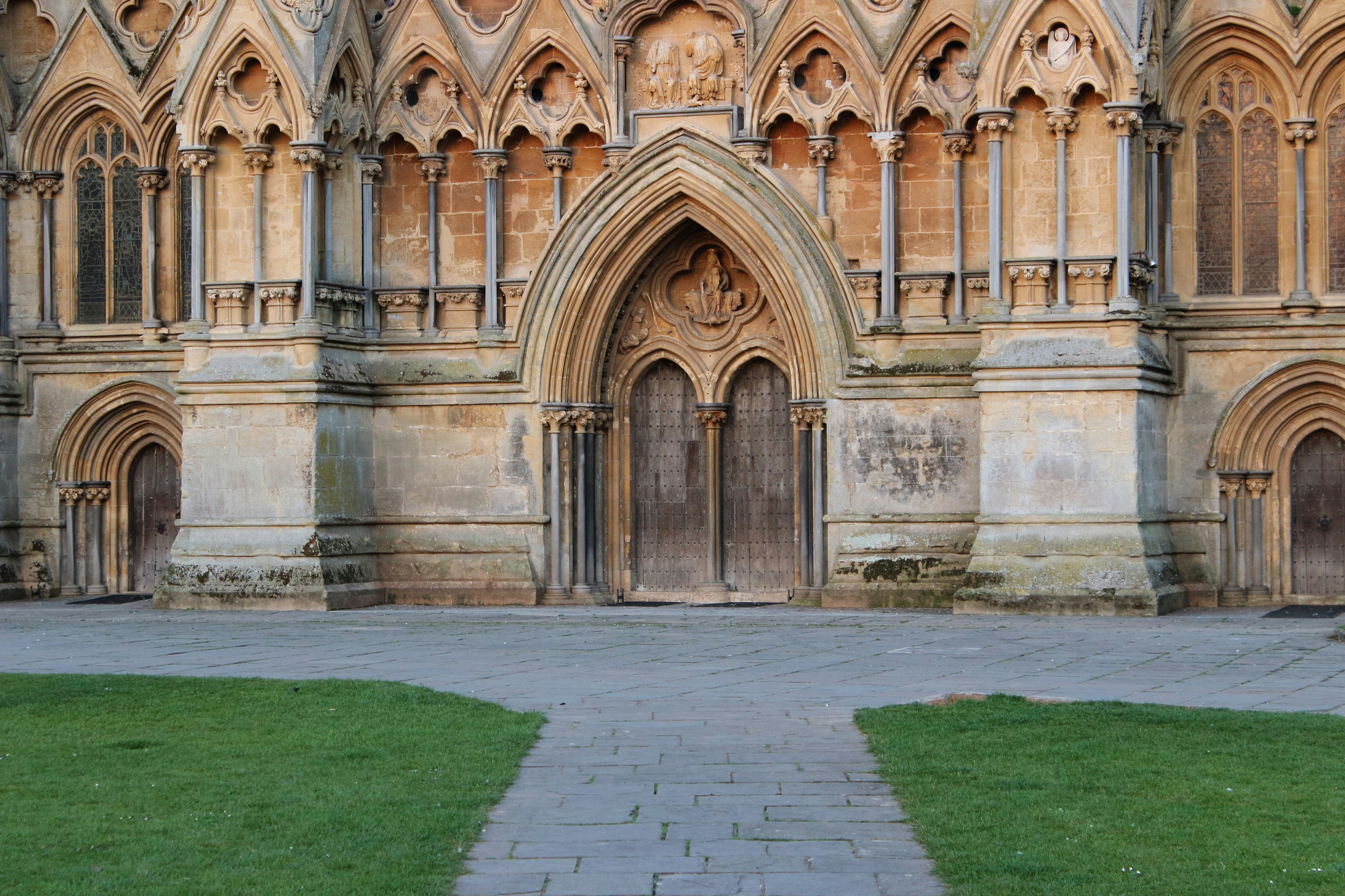 a large building with a stone walkway in front of it