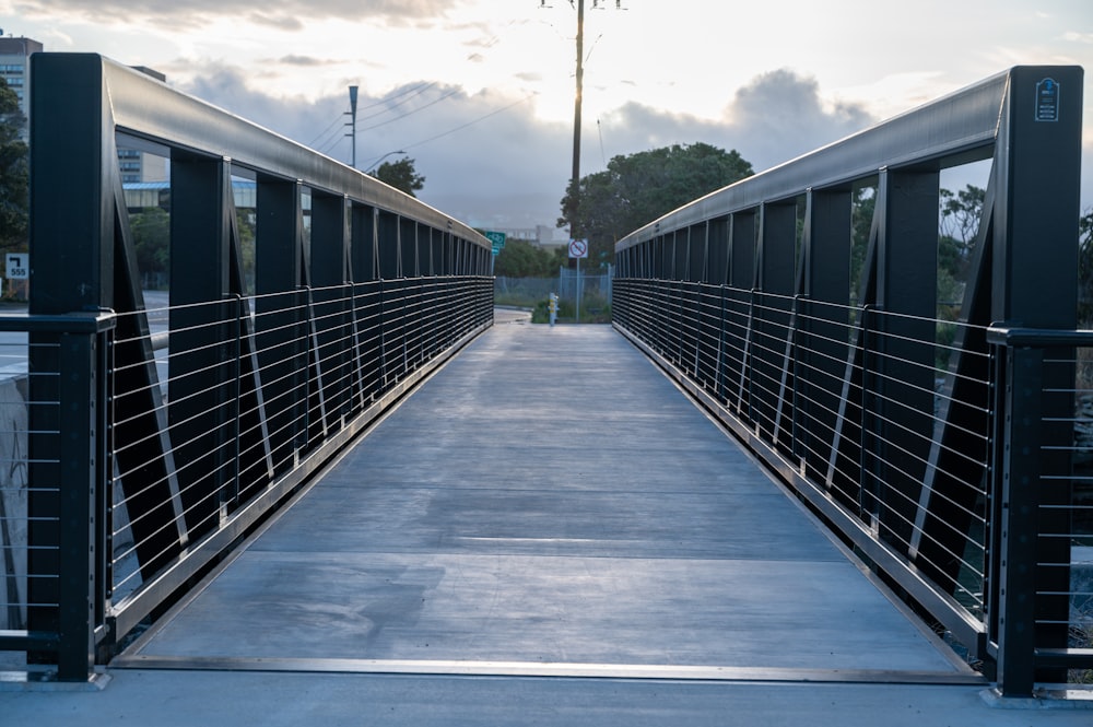 a bridge that has a metal railing on it