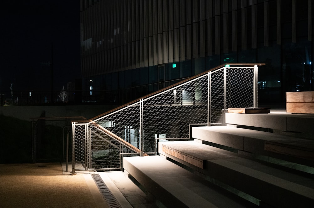 a set of stairs lit up at night