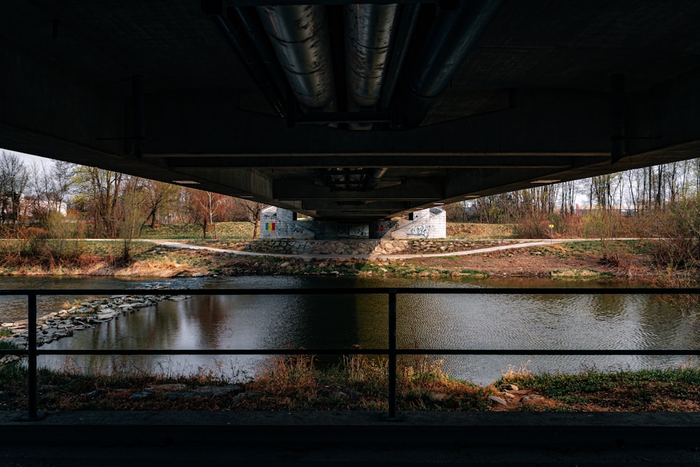 a view of a river under a bridge