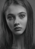 a black and white photo of a woman's face