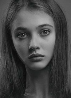a black and white photo of a woman's face