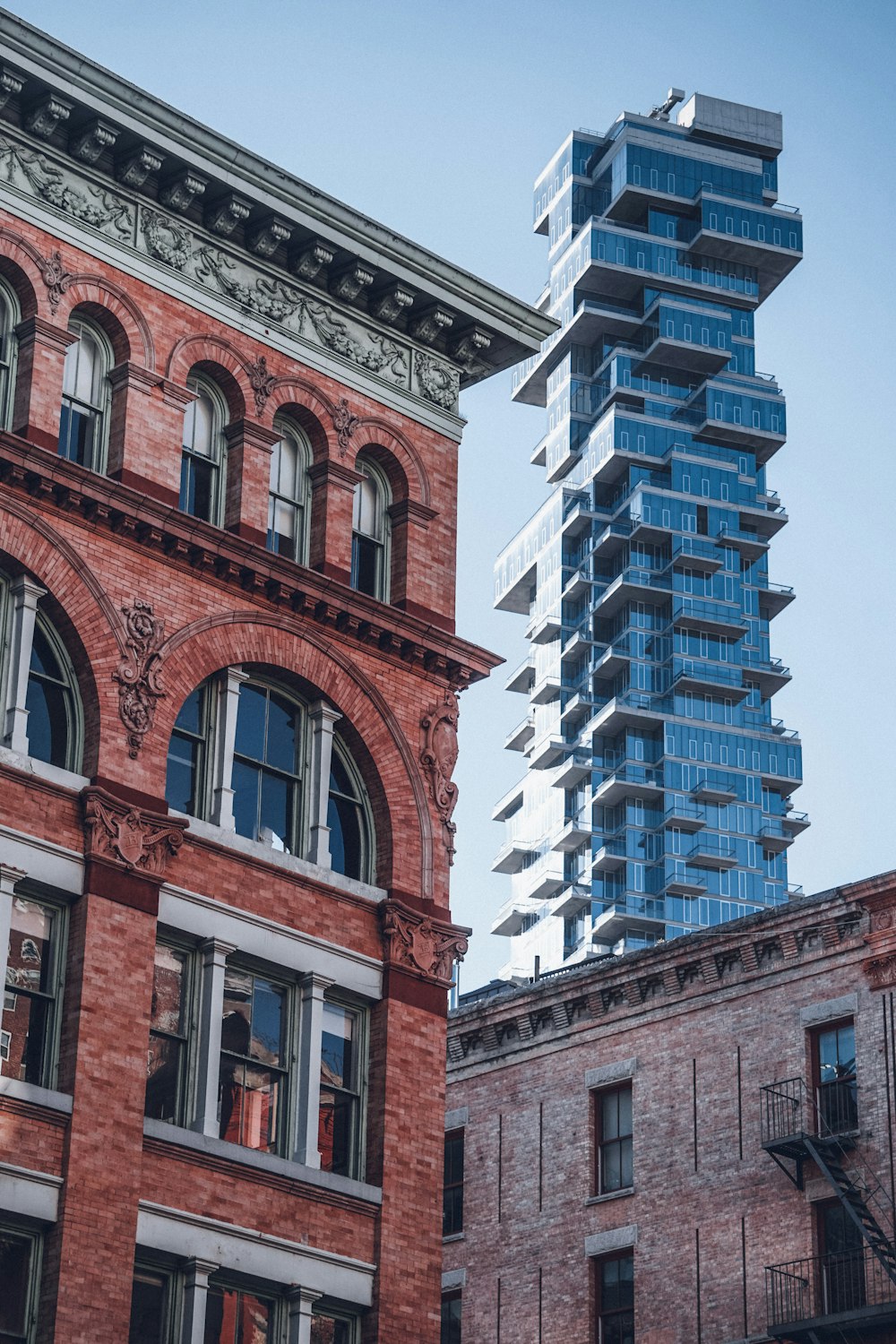 a very tall building next to a very tall building