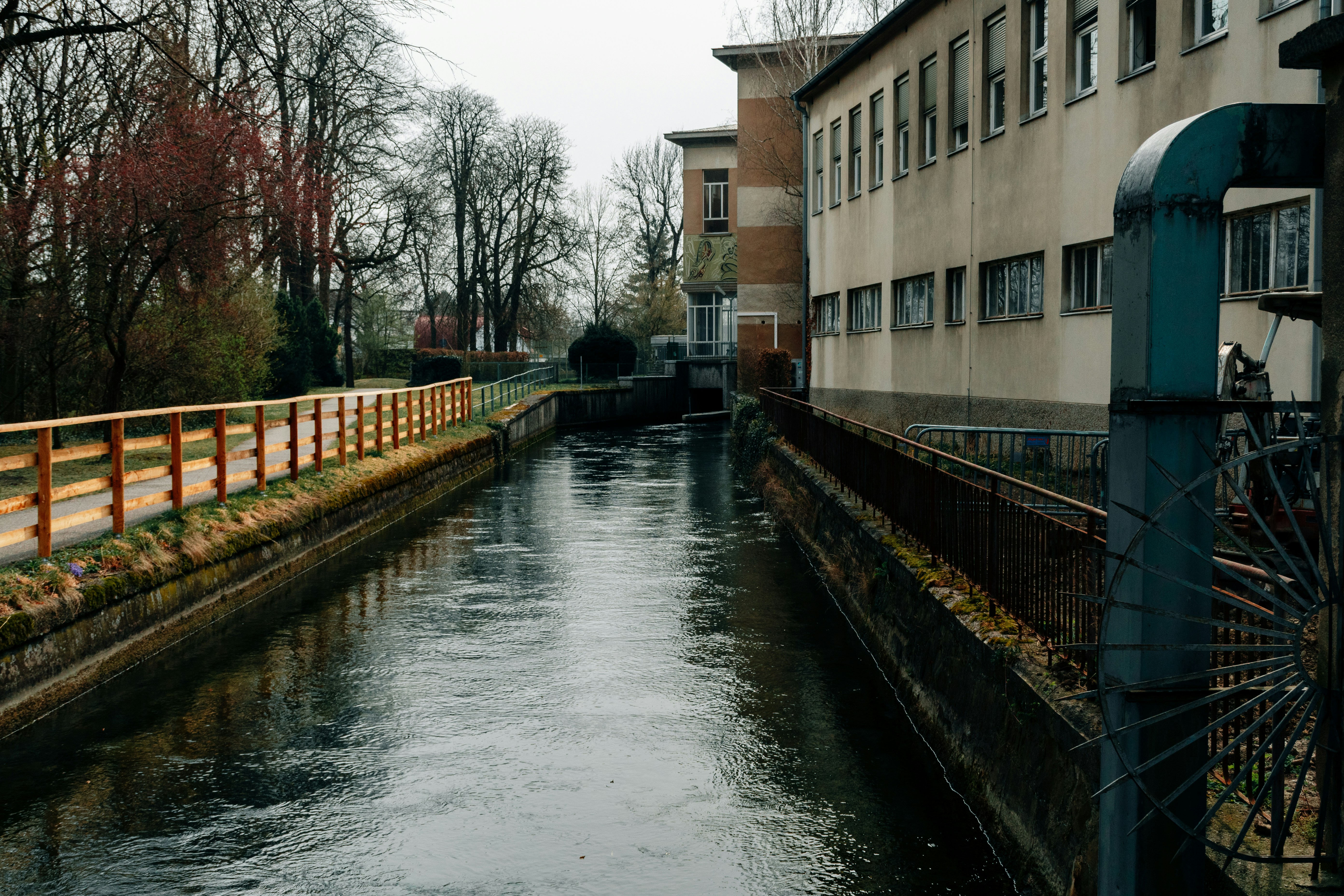 a river running through a city next to tall buildings