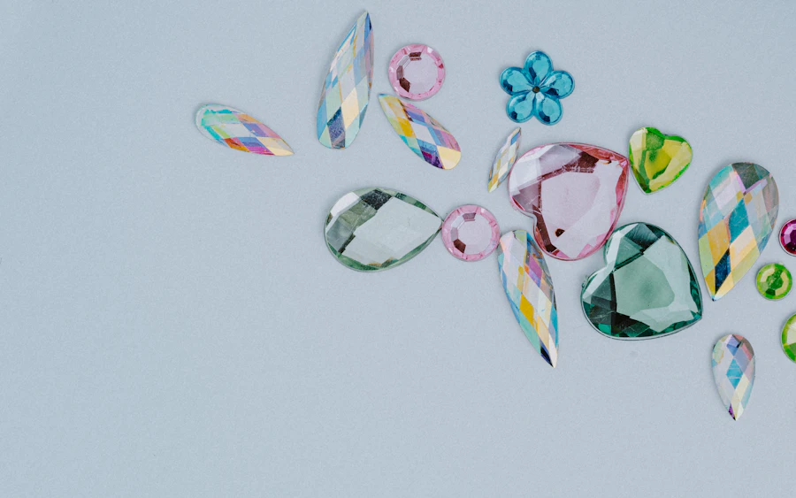 Coloured gemstones of different cuts on a pale surface