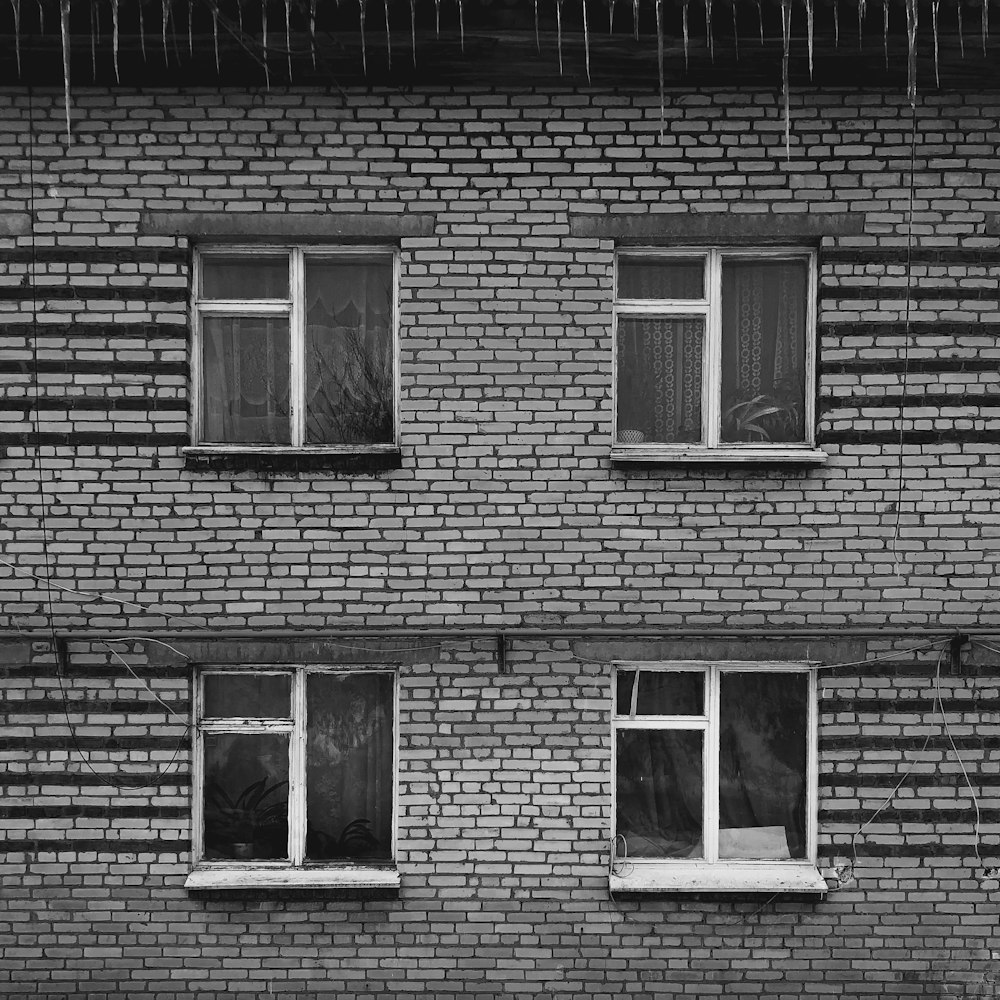 a black and white photo of a brick building