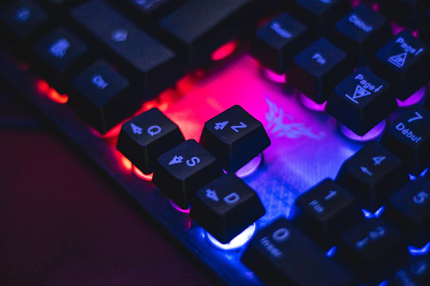 a close up of a keyboard with a red and blue light