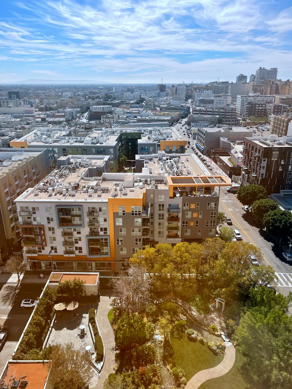 an aerial view of a city with lots of tall buildings