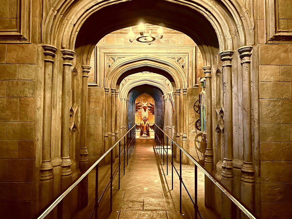 a long hallway with a metal hand rail