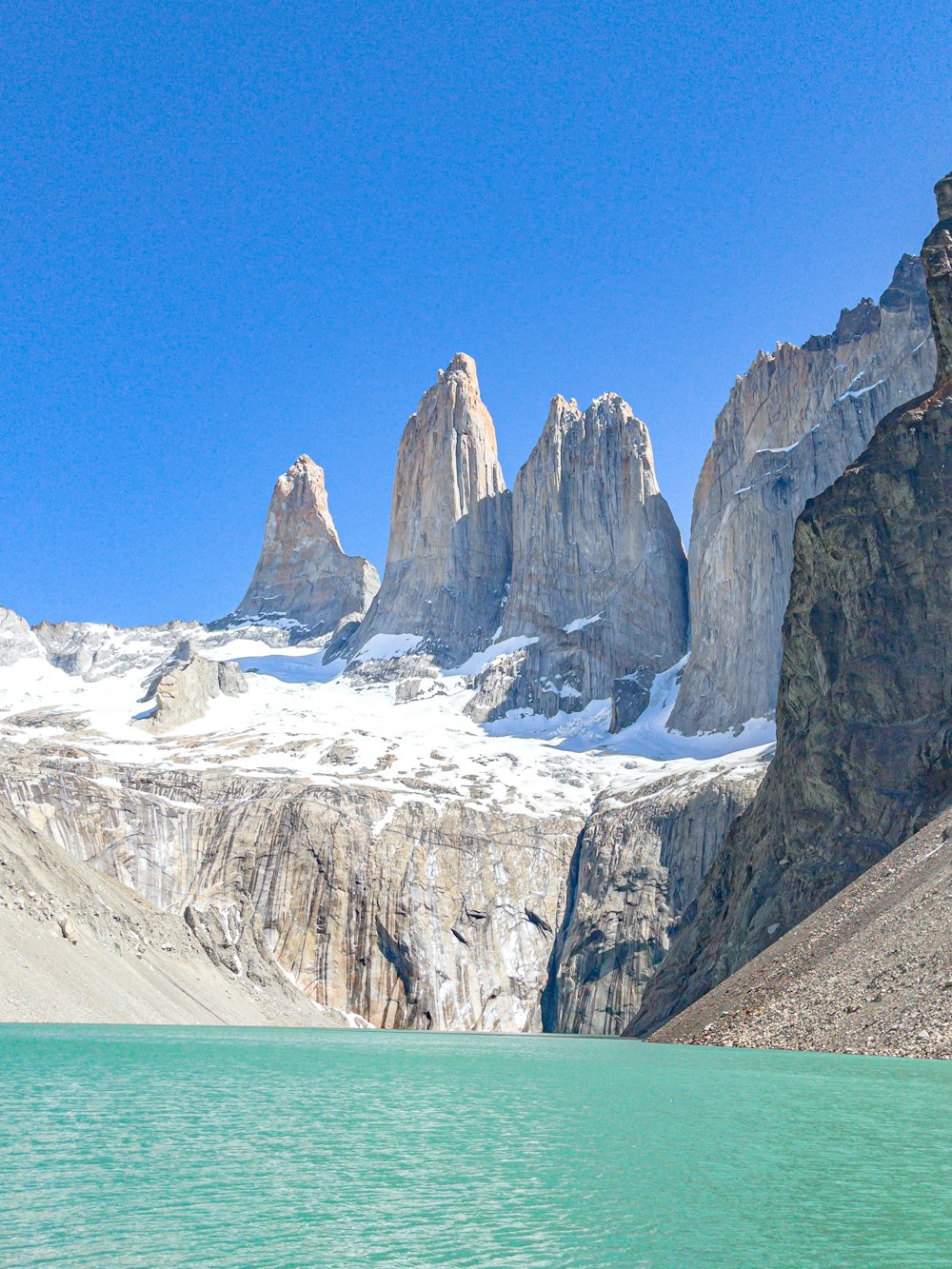 a mountain range with a body of water in front of it