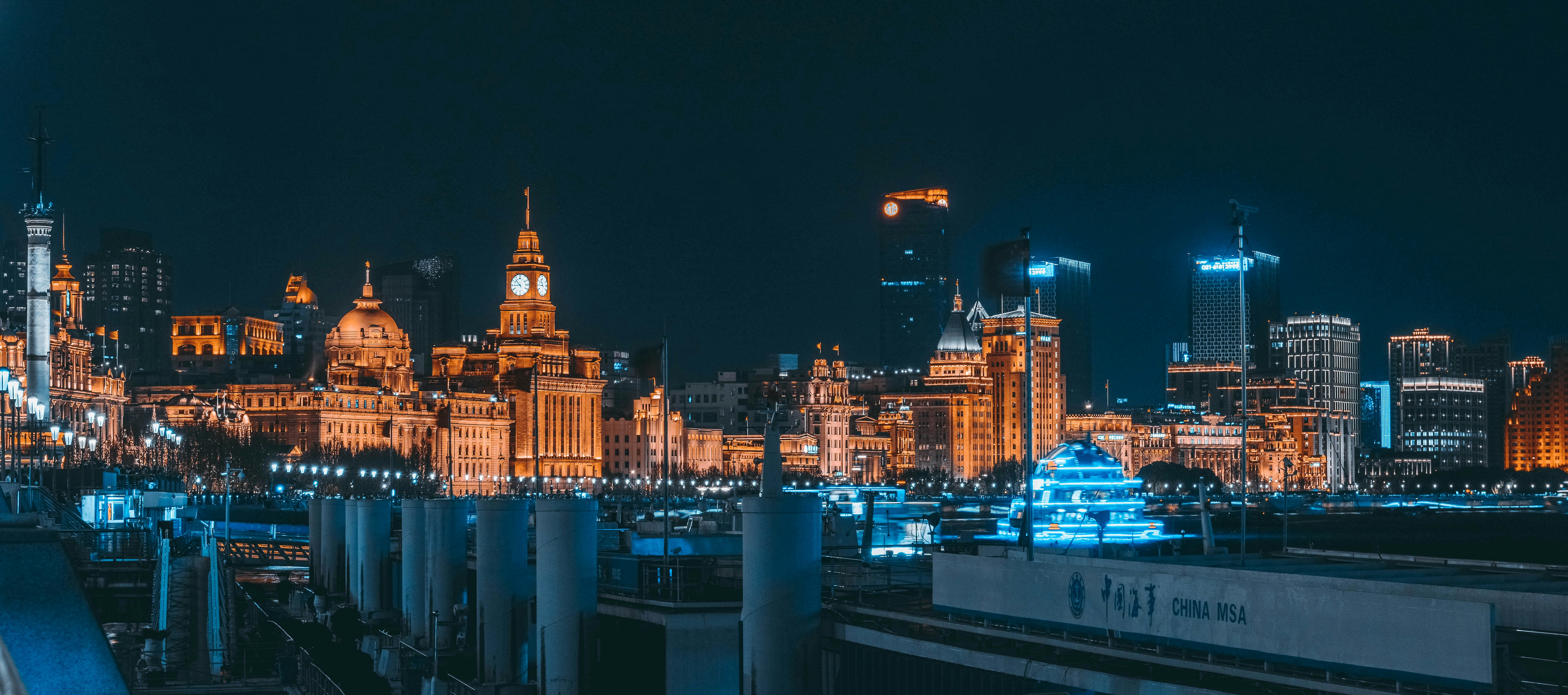 a view of a city at night from a bridge