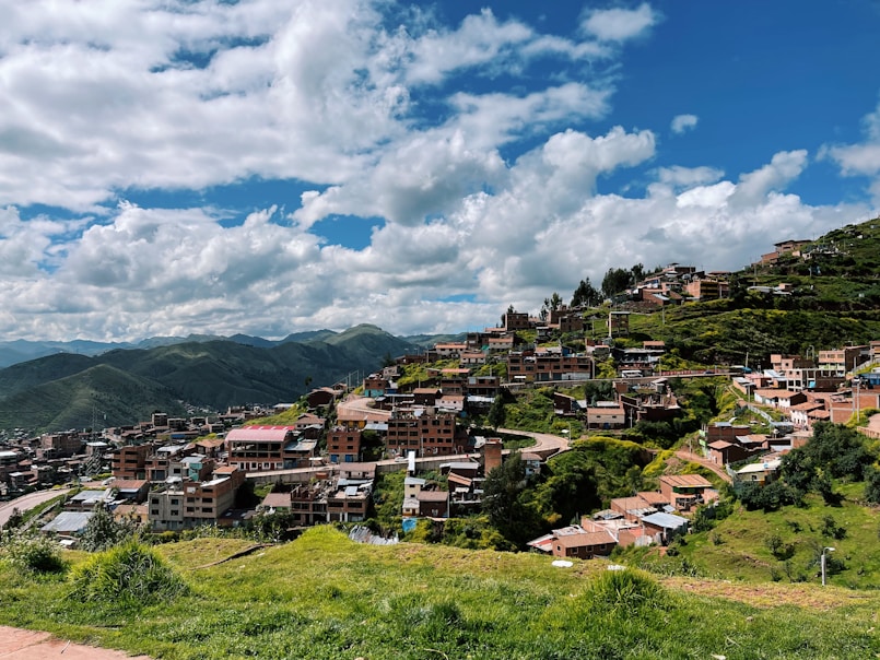 a village on a hill with a sky background
