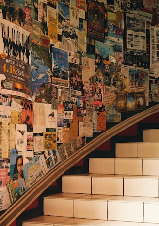 The cozy interior of the youth center with posters of past events on the walls