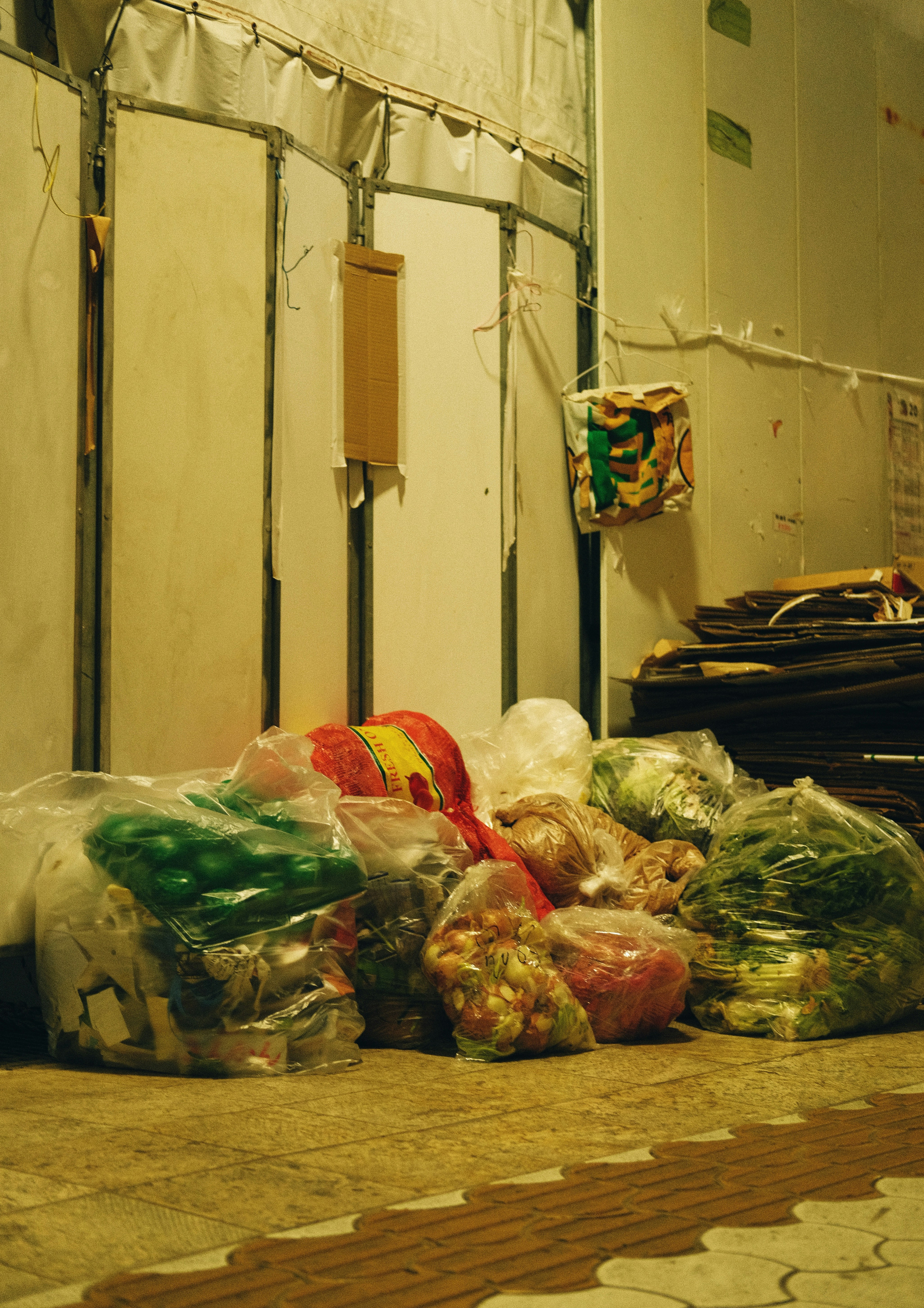 a pile of bags of food sitting on the ground