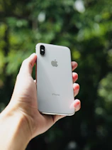 a person holding an iphone in their hand