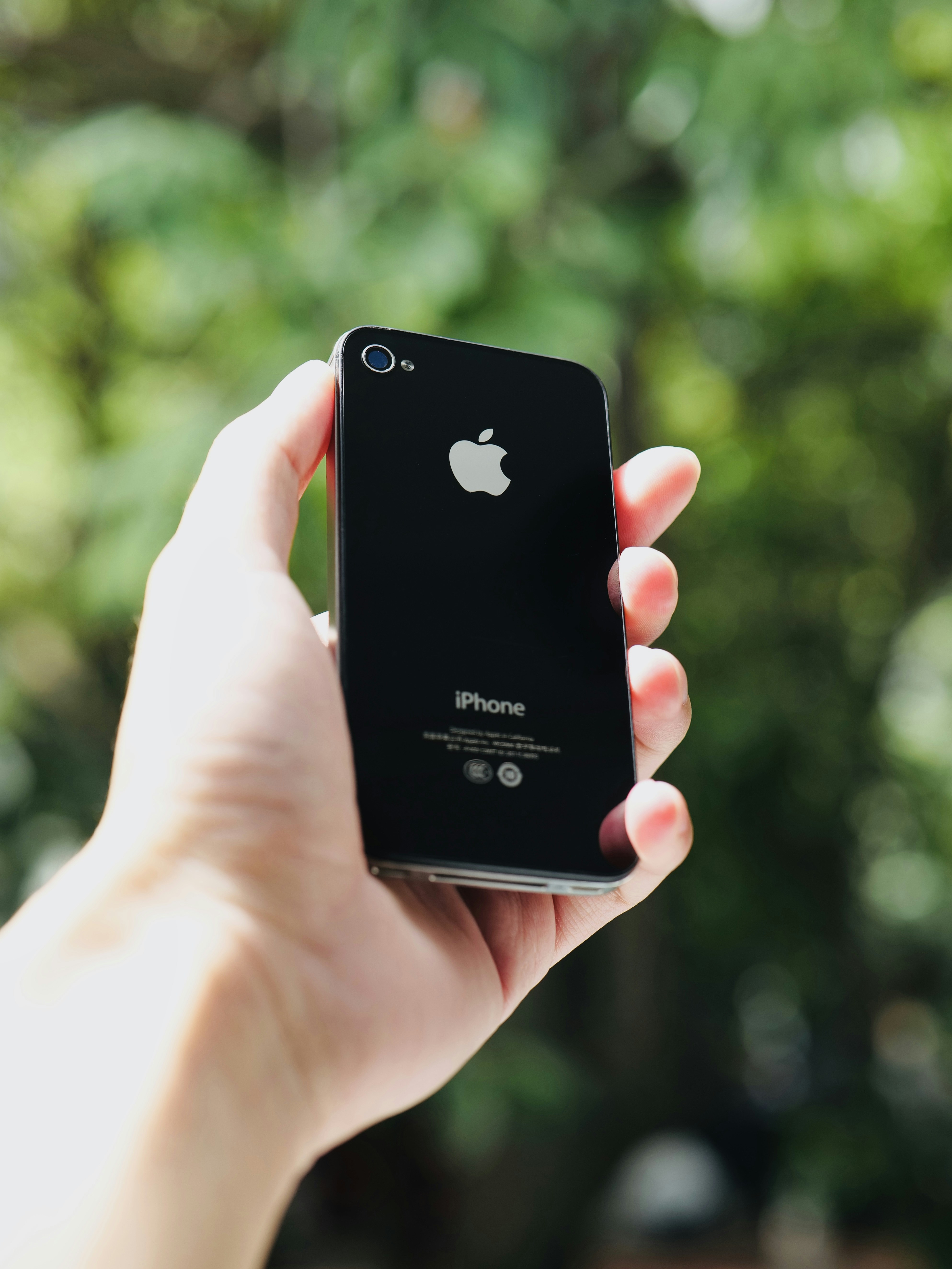 a person holding an iphone in their hand