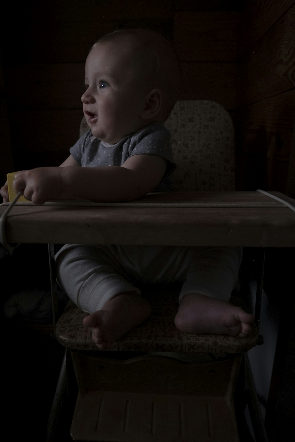 a baby is sitting in a high chair