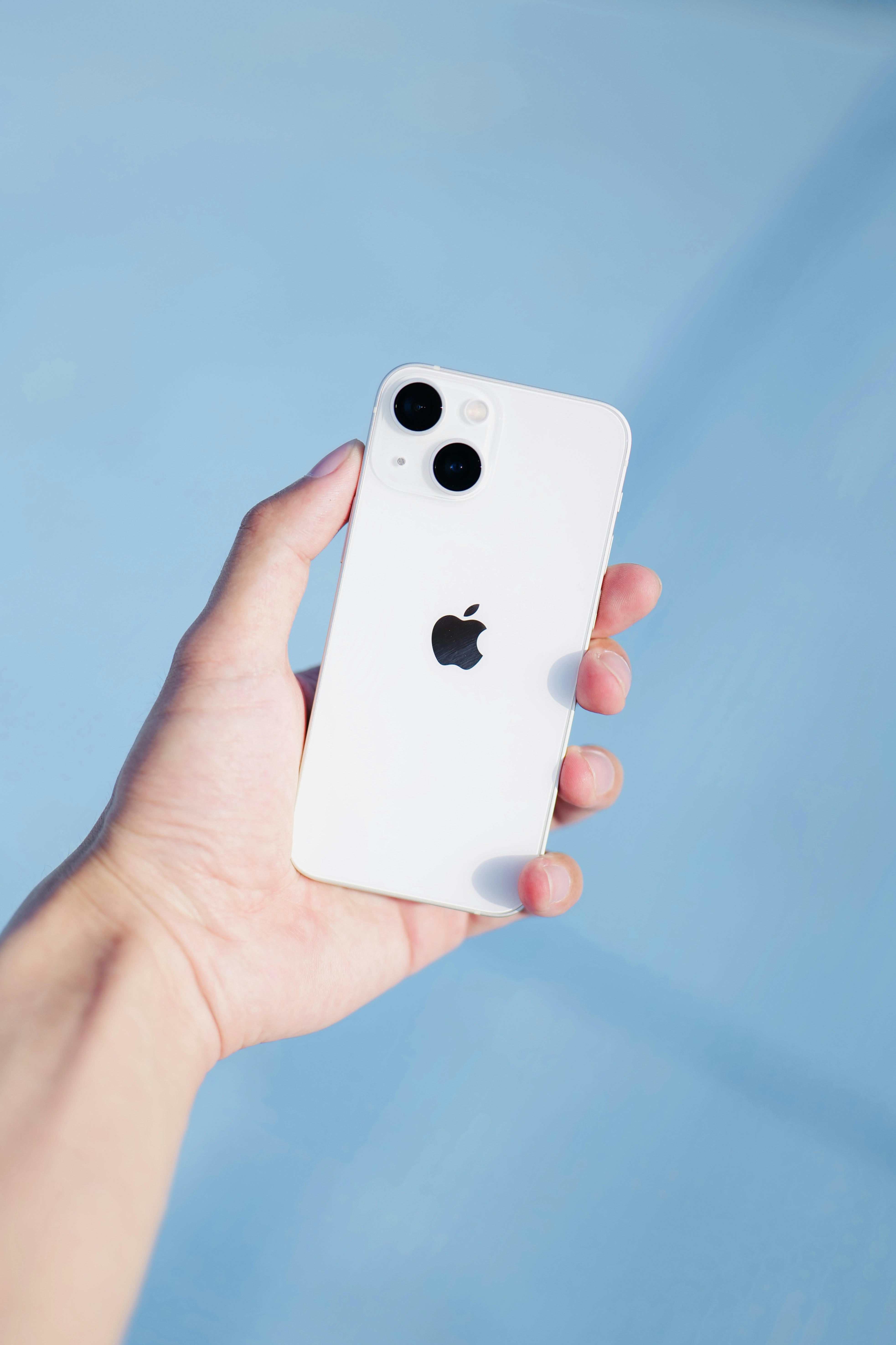 a person holding an iphone in their hand