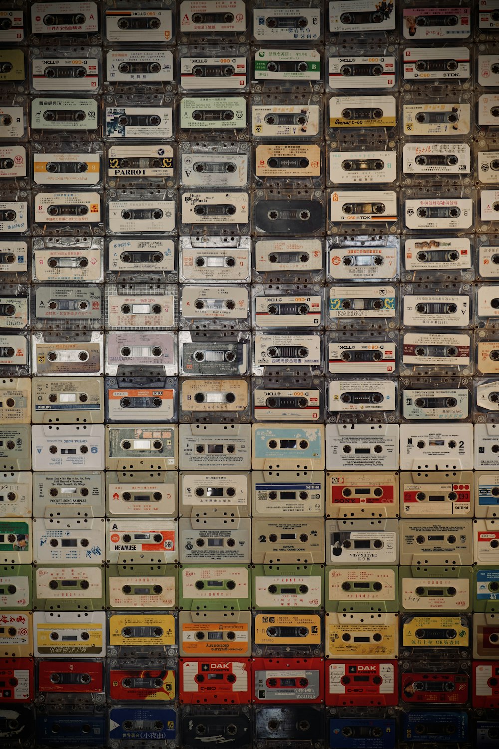 a wall full of old cassette tapes and tape recorders