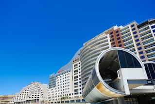 A welcoming virtual tour interface showing a 360-degree photo of the complex's main entrance.