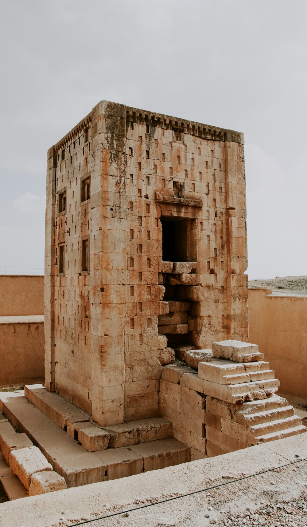 a brick structure with steps leading up to it