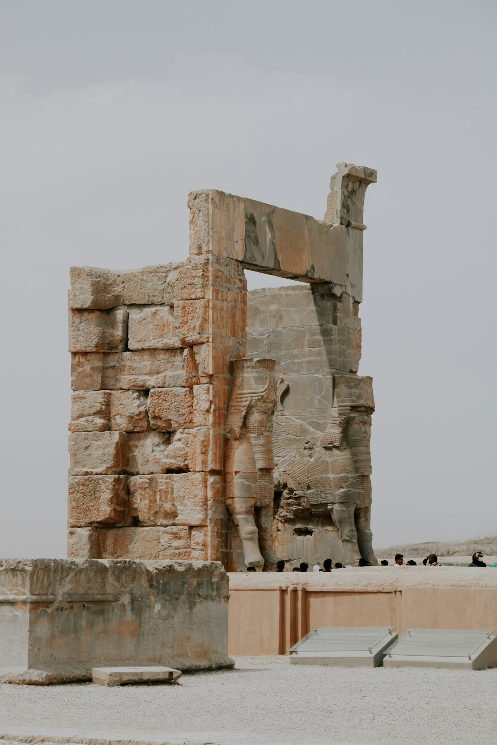 a large stone structure sitting in the middle of a desert