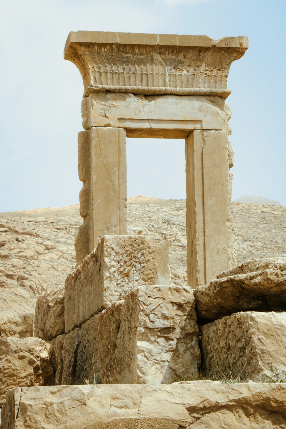 a stone structure with a window in the middle of it