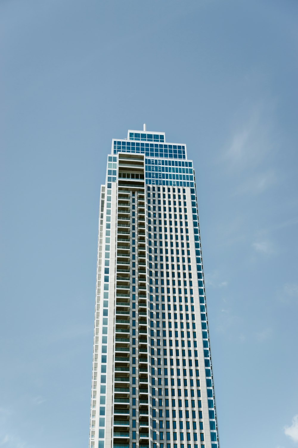 a very tall building with a sky background