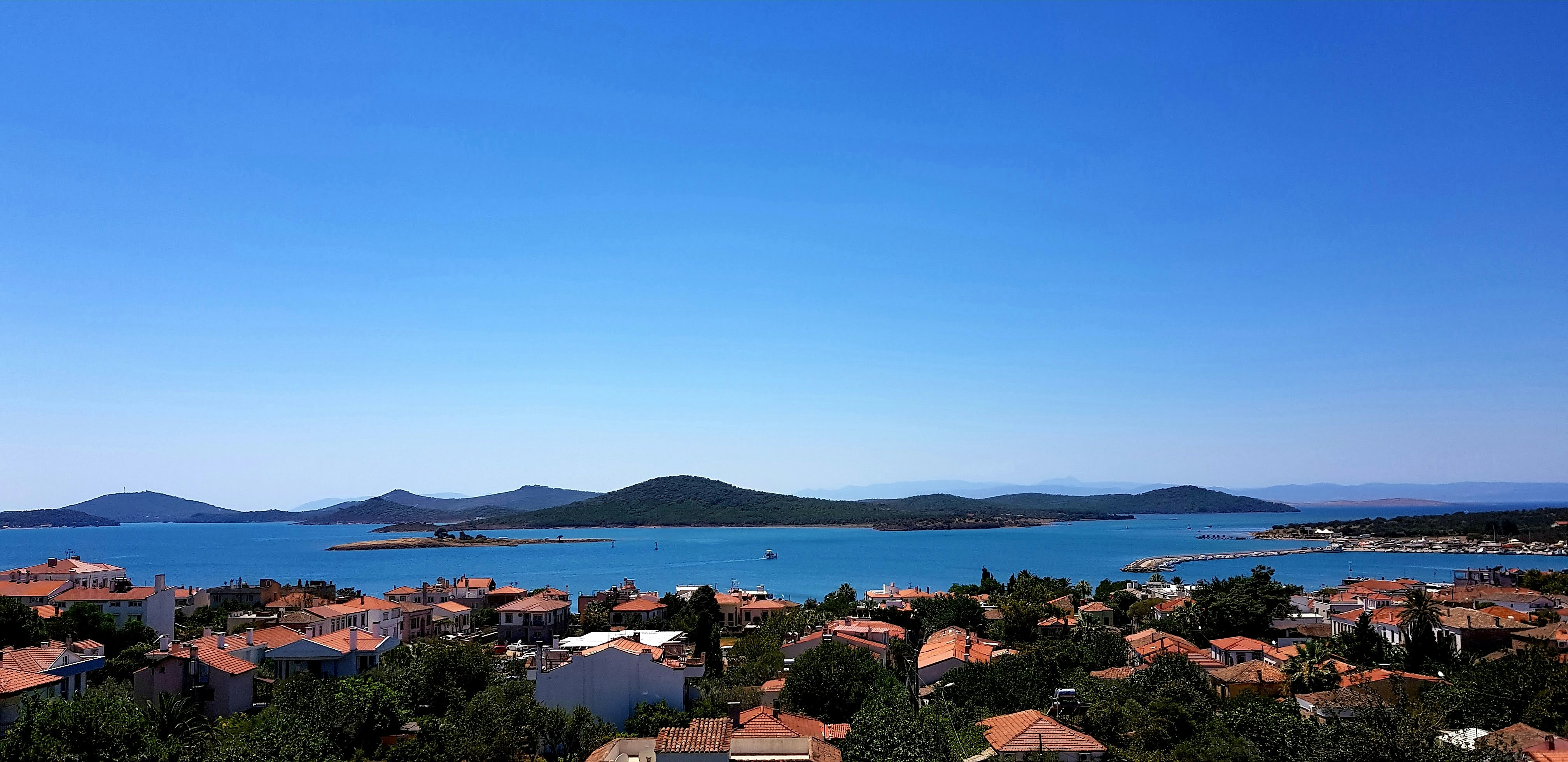 a view of a town and a body of water