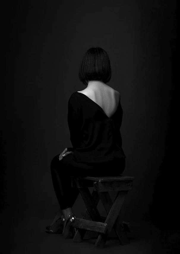 a man sitting in a dark room