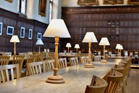 a long table with several lamps on top of it