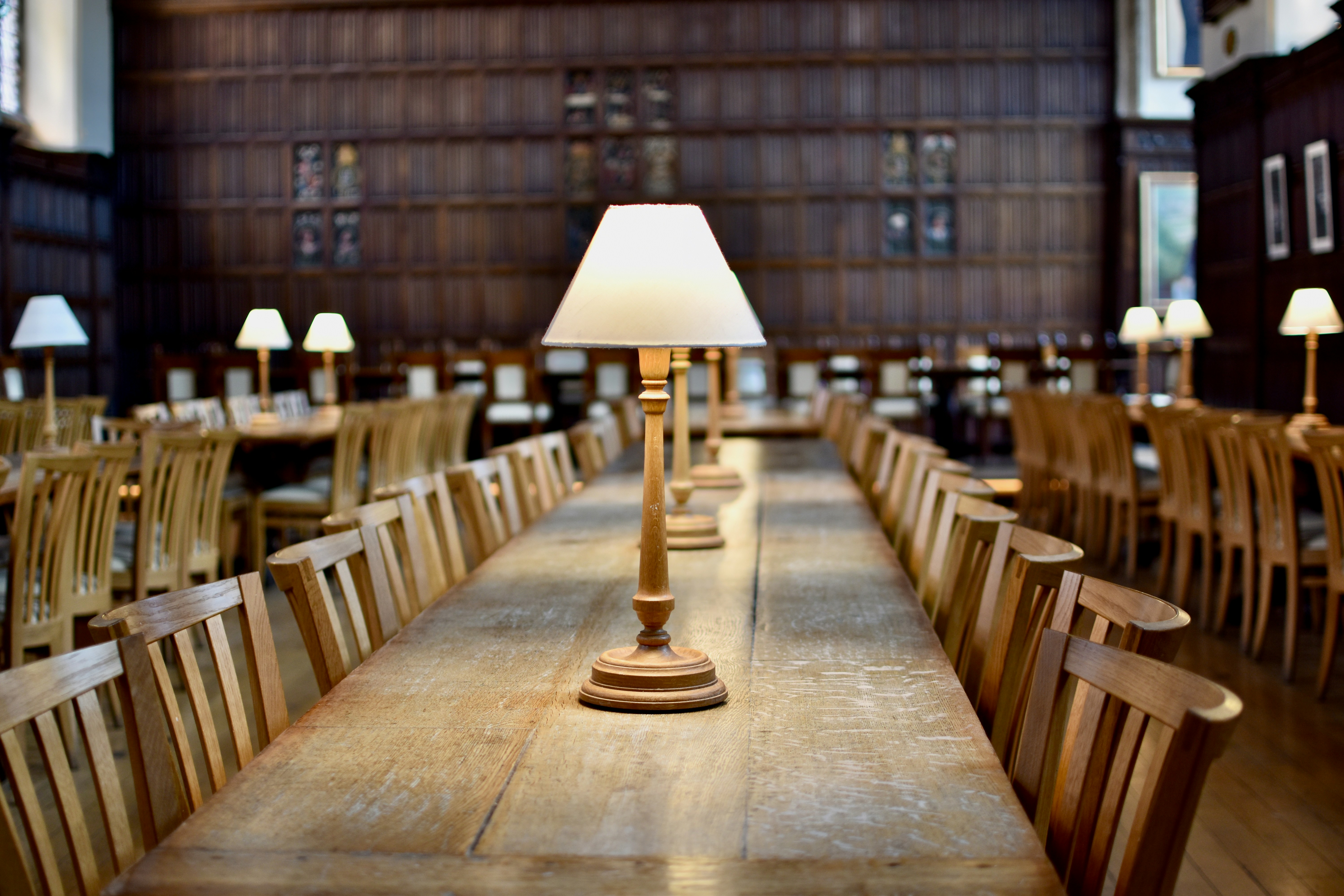 a long table with a lamp on top of it