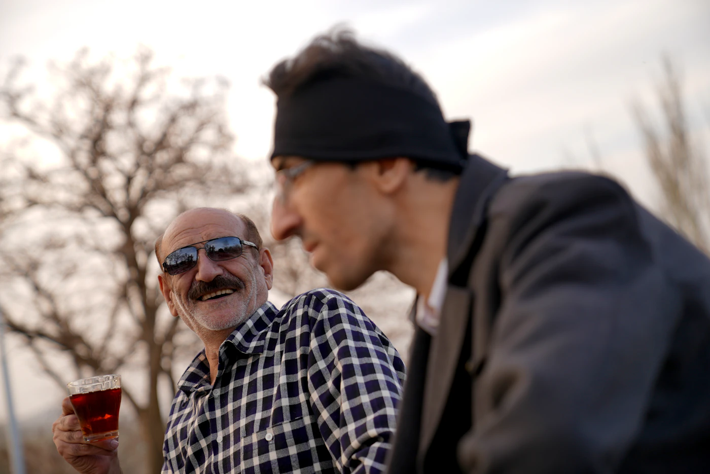 An older man and a younger man sharing a laugh