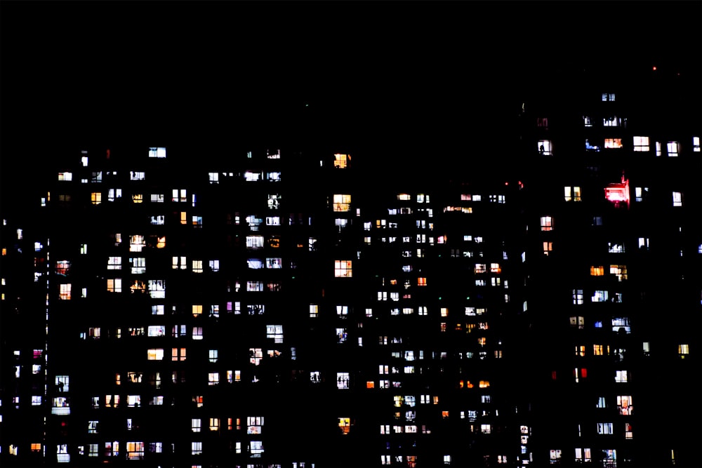 a night view of a city with lots of windows