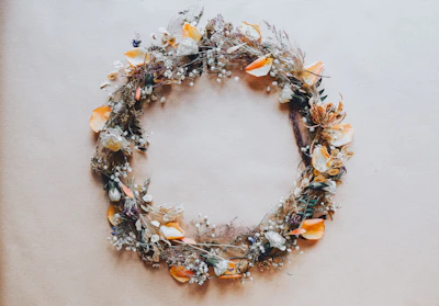 Handcrafted floral wreath made with dried flowers and natural twine.