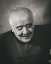 Portrait of Nayan Chatwani, the founder of NTG Logistics, smiling confidently in a warehouse setting.